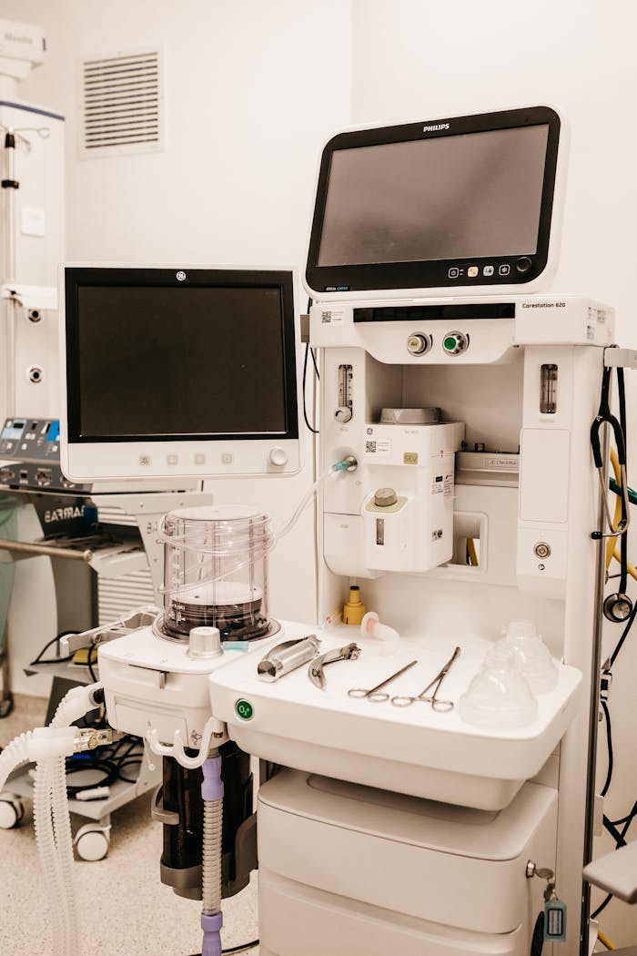 services-03 High-tech medical equipment setup in a hospital room, featuring monitors and surgical tools.
