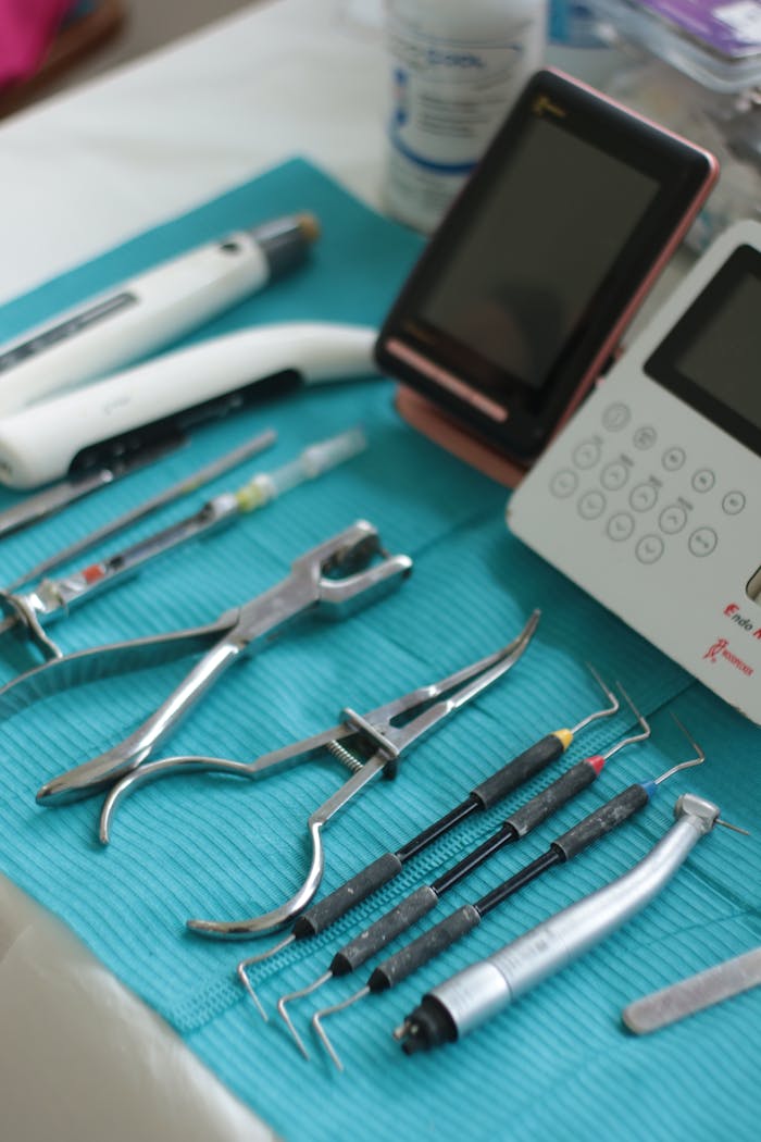 Dental tools and equipment neatly arranged for a procedure in a modern clinic.
