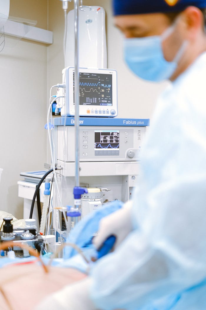 gallery-3 Doctor uses ECG monitor in hospital setting. Focus on healthcare and medical technology.