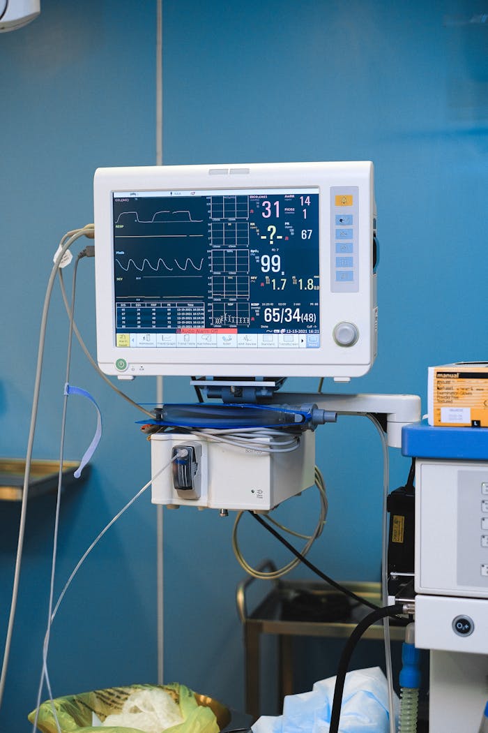 gallery-4 Close-up of a hospital monitor displaying vital signs and heart rate data.