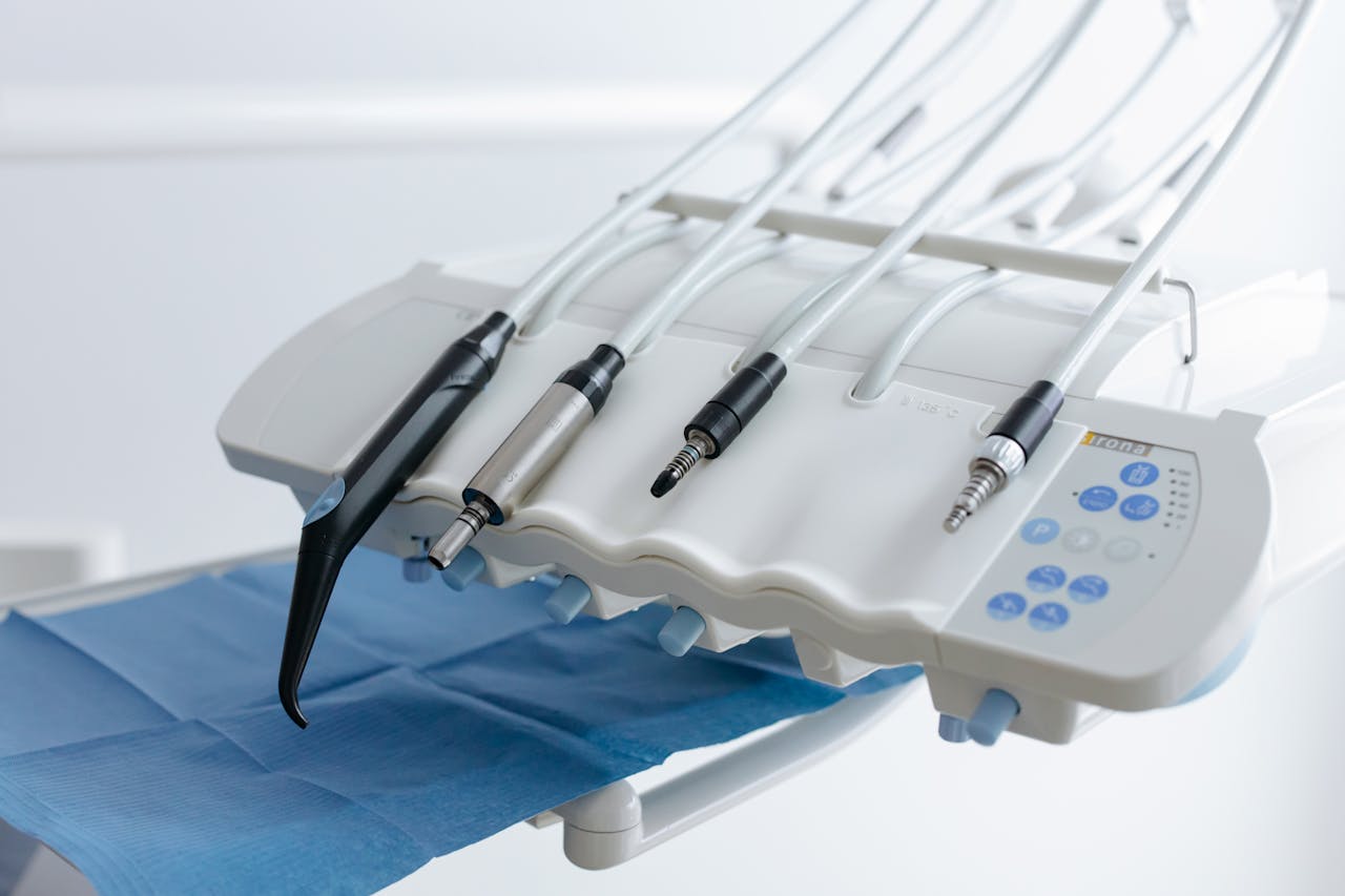Close-up of dental equipment with handpieces, showcasing modern dental care tools in a clinic.